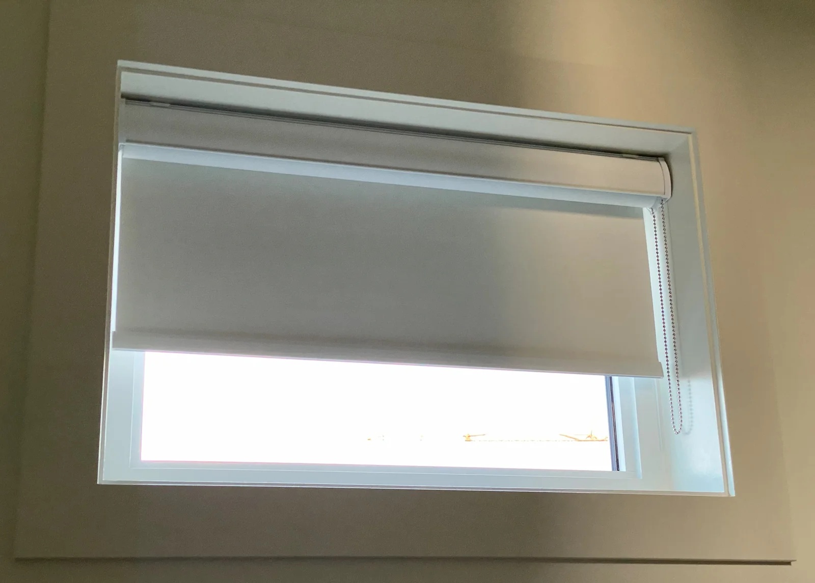 A closer look at a roller shade and headrail