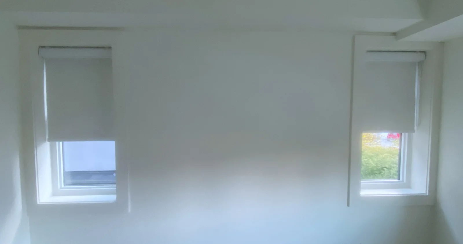 Matching roller shades on two narrow windows